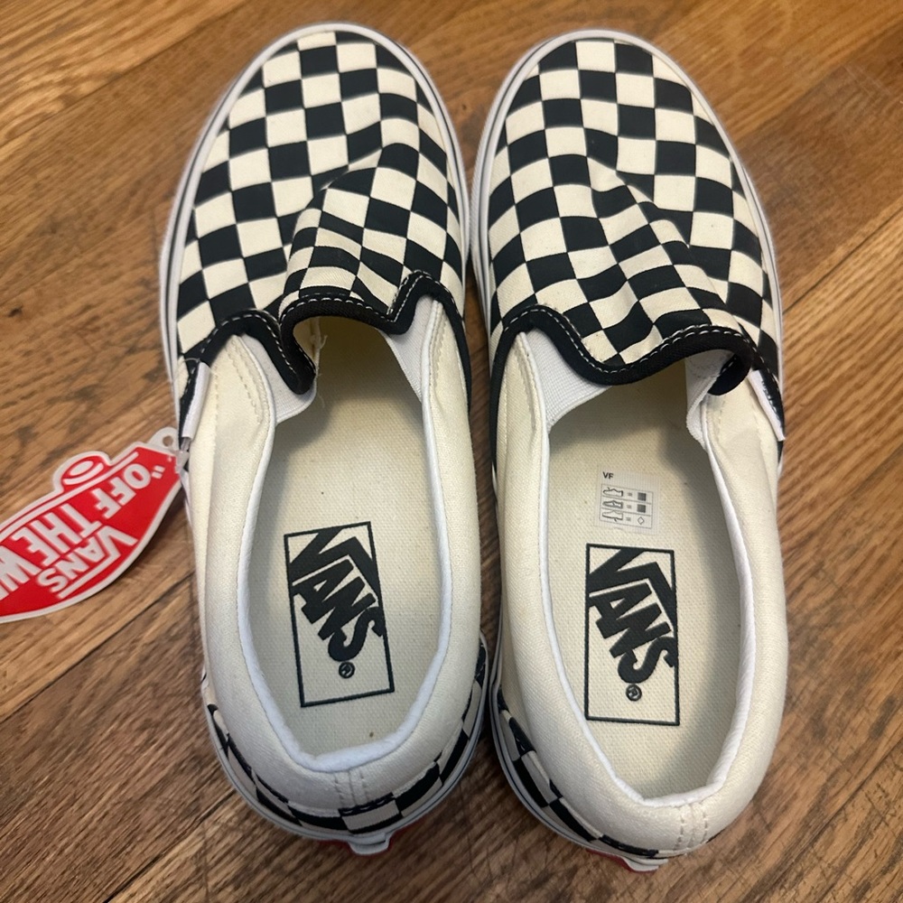 Vans Black and White Moccasin Slip-Ons